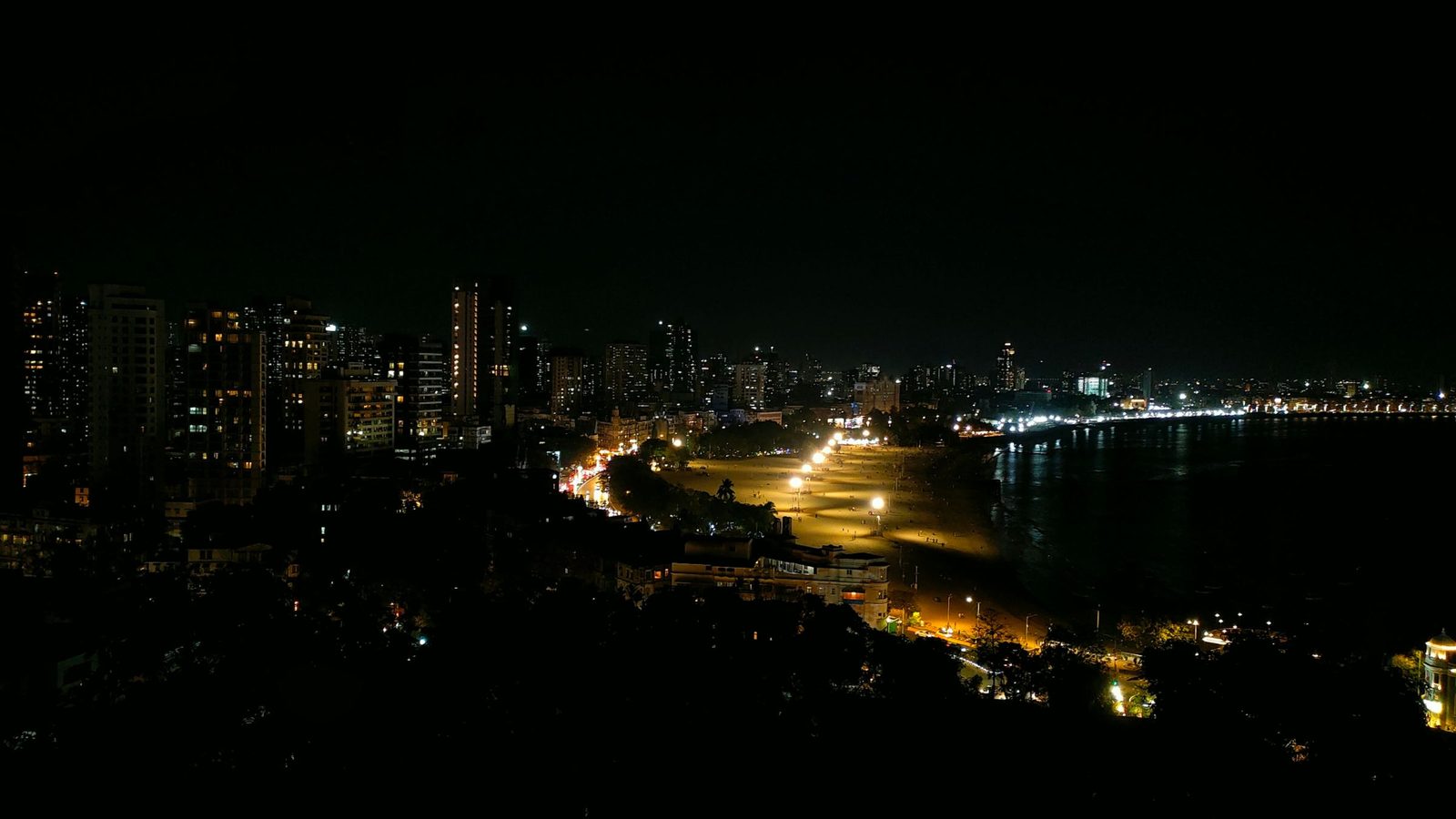 The lit towers along Marine Drive in Mumbai at night.