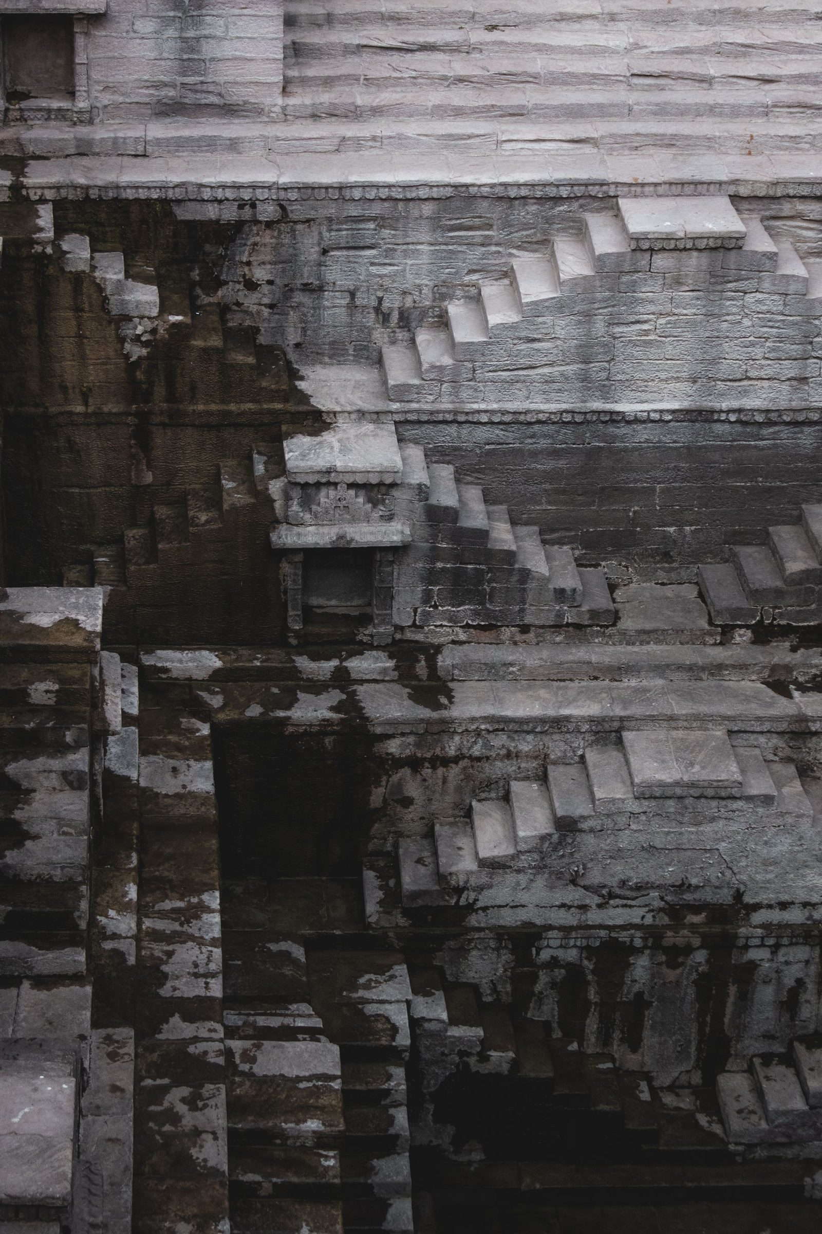 Carved stone steps and walls of an old stepwell in Jaisalmer.