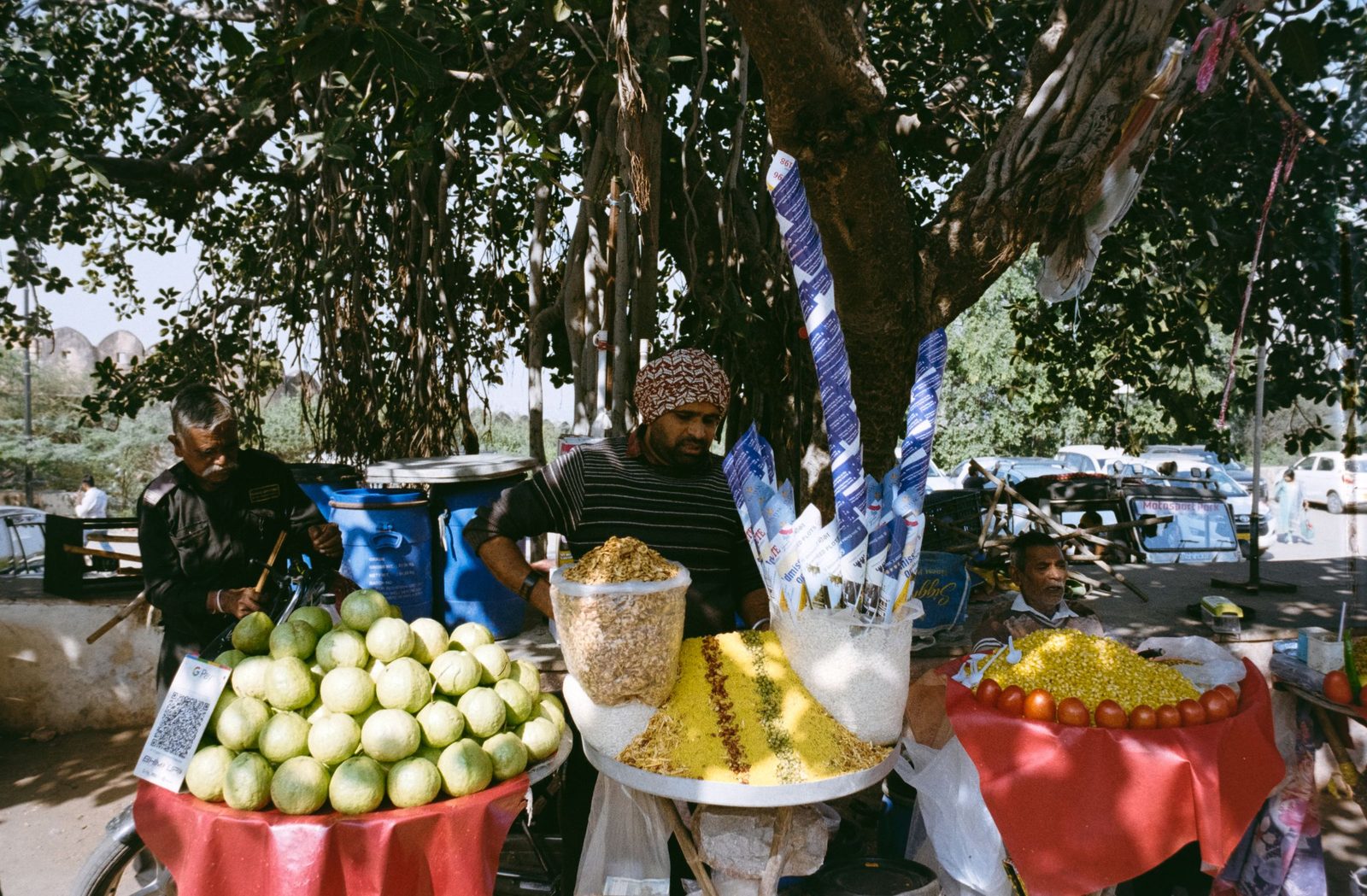 Vendors and produce fill a street food market in Jaipur.