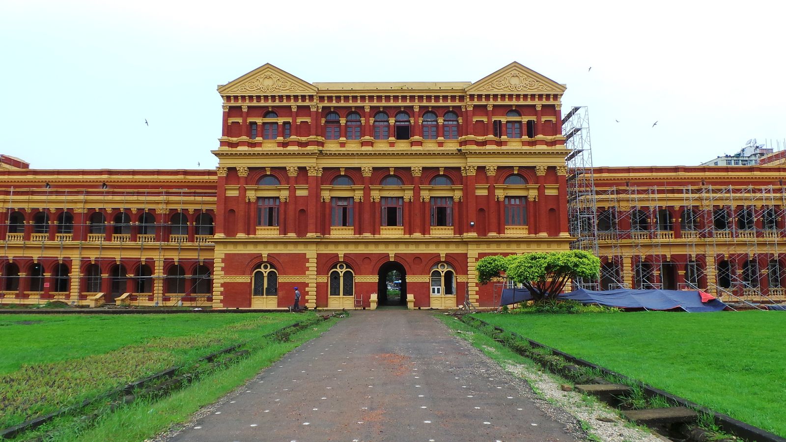 The red-brick colonial Secretariat building in Yangon behind its front lawn