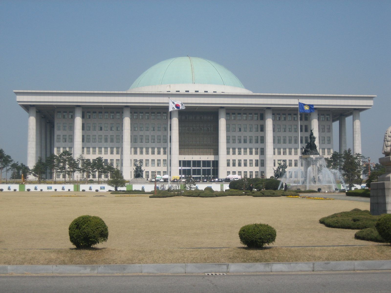 The green-domed National Assembly building in Yeouido, Seoul, seen across its front lawn