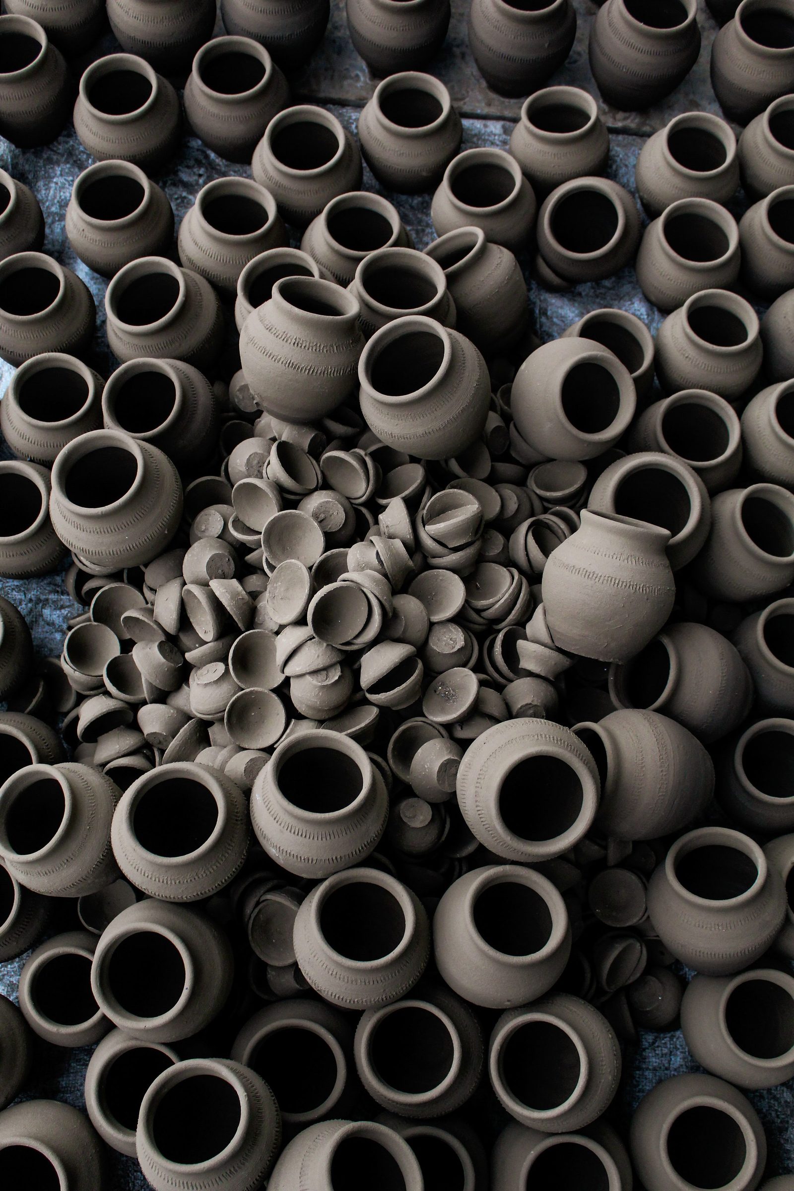Rows of handmade clay pots in Bhopal seen from above.