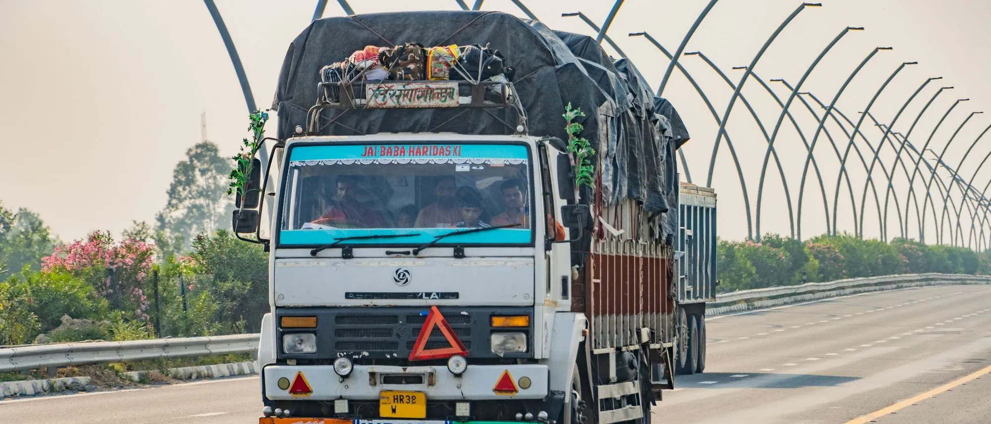 A white goods truck travels along an expressway near Deeg in Uttar Pradesh.