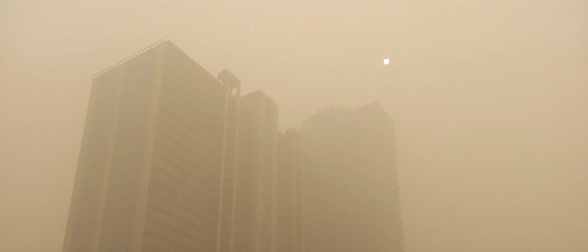High-rise towers fading into thick brown smog in Delhi, November 2017