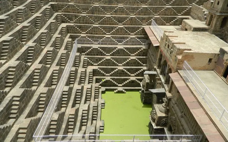 Aerial view of the geometric stone steps of Chand Baori stepwell in Abhaneri, Rajasthan.